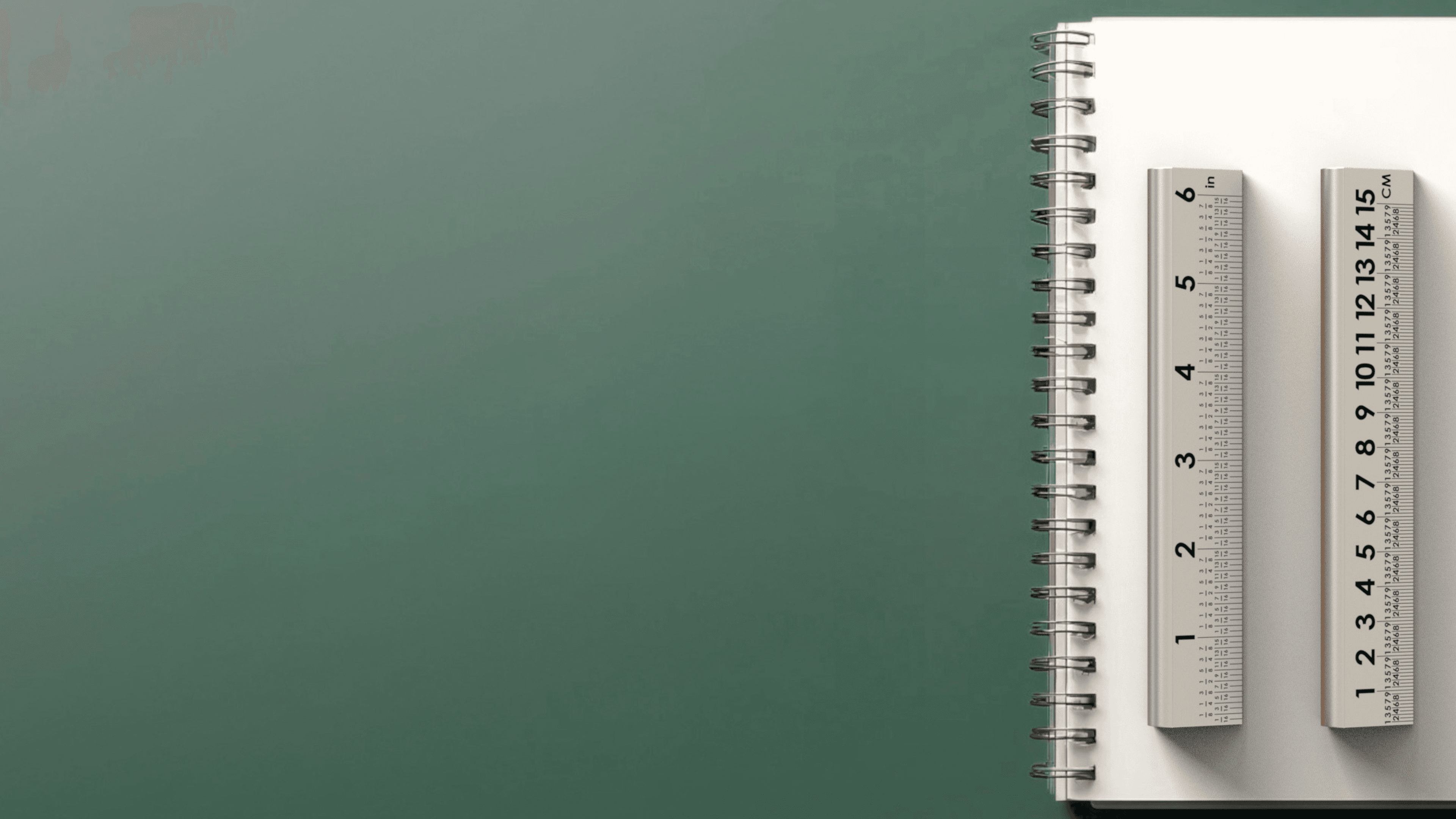 Slope Sight stage three background showing a notebook and rulers on a green desktop